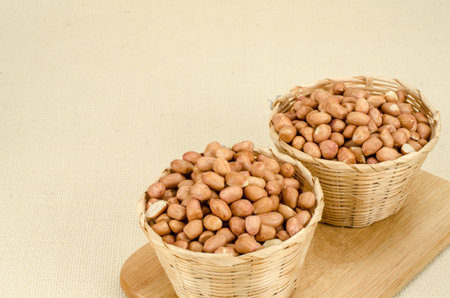 Image of raw peanuts in bamboo woven