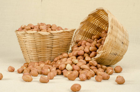 Image of raw peanuts in bamboo woven