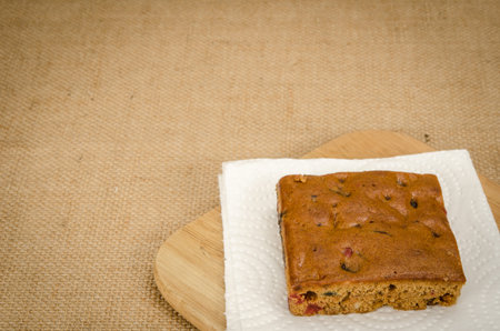 Image of fruit cake on wooden cutting board
