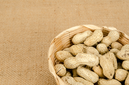 Image of roasted peanuts on brown sack backgroundの写真素材