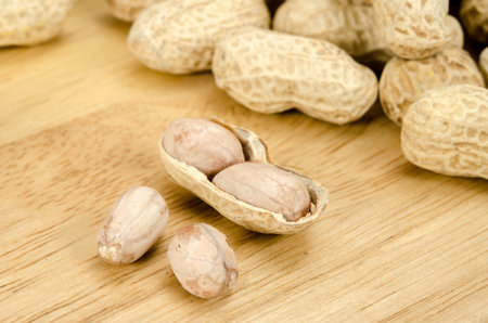 Image of roasted peanuts on brown sack background