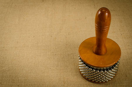 Image of Latin's percussion Cabasa on brown sack backgroundの写真素材