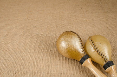 Image of maracas a latin percussion on brown sack background