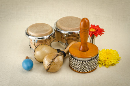 Image of latin percussion set with flower on brown sack backgroundの写真素材