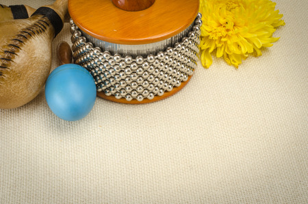 Image of latin percussion set with flower on brown sack backgroundの写真素材