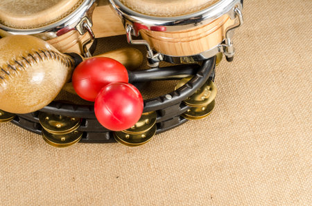 Image of latin percussion set on brown sack background
