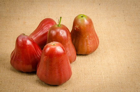 Image of rose apple on brown sack background