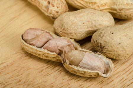 Image of peanuts on wooden board