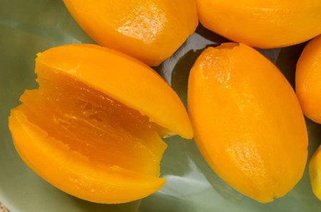 Image of peel marian plum on fabric background
