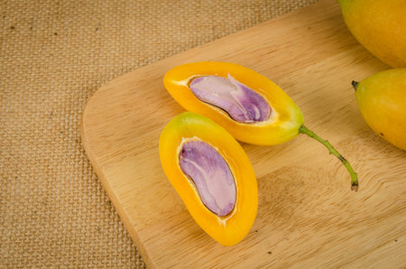 Image of fresh marian plum on fabric background