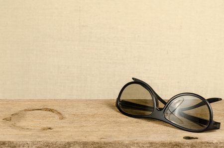 Image of eyeglasses on old wood
