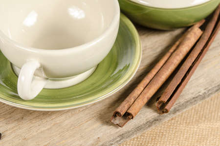 Image of tea set with cinnamon stick on brown sack backgroundの写真素材