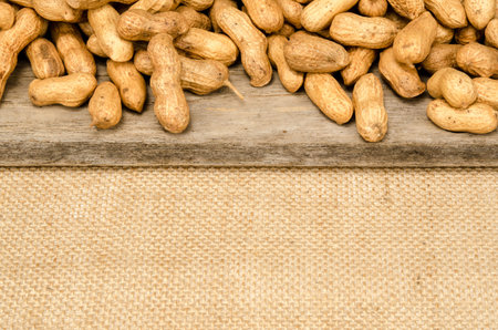 Peanuts on old woodの写真素材
