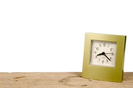 Clock on old wood on white background