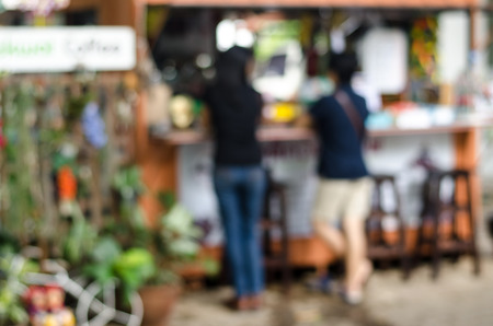 Blurred people in front of shopの写真素材