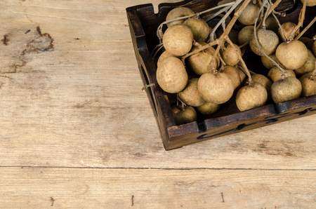Longan on wood boardの写真素材