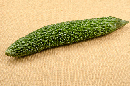 Bitter gourd on brown sack backgroundの写真素材