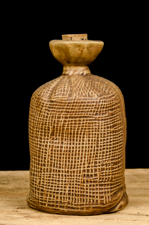 Old Chinese ceramic bottle on black backgroundの写真素材