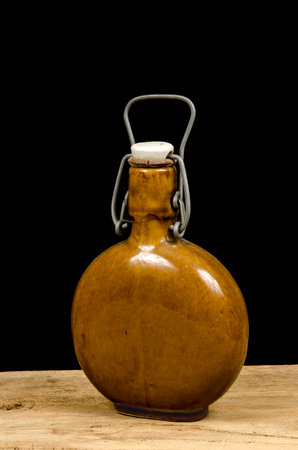 Old Chinese ceramic bottle old black backgroundの写真素材