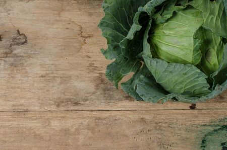Green fresh cabbage on old wood deskの写真素材
