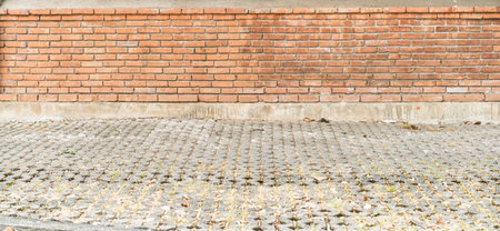 Brown brick wall with concrete block floorの写真素材