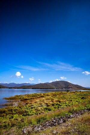 Landscape of mountain and lake with blue sky backgroundの写真素材