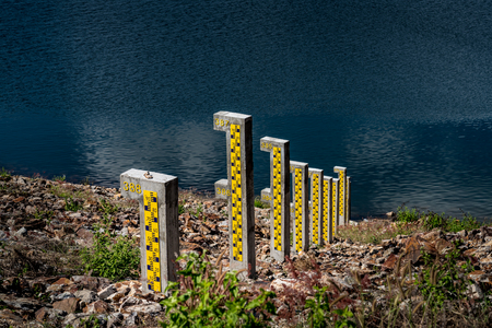 Water level pole at reservoirの写真素材