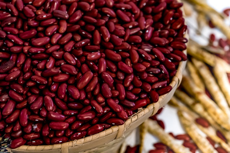 Red beans in the bamboo weave basketの写真素材