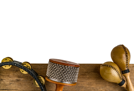 Flat lay of Latin percussion on brown wood desk isolate on white backgroundの写真素材