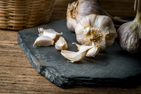Image of Garlic on black stone plateの写真素材