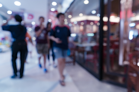 Image of blurred people in shopping mall store for background usageの写真素材