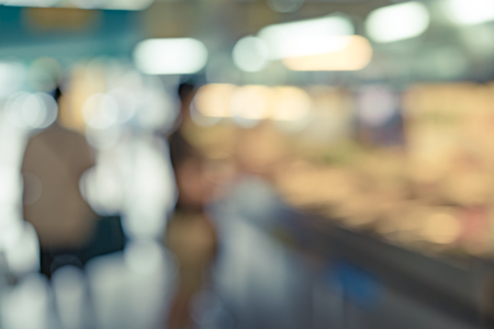 Abstract blur image of people in food market for background usageの写真素材