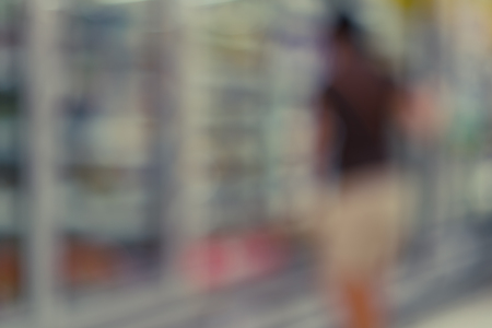 Abstract blurred image of people in supermarket for background usageの写真素材