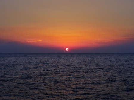 Beautiful sunset in aegean sea upon a boatの写真素材