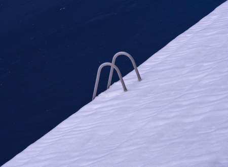Diving ladder in an Austrian Alps frozen lakeの写真素材