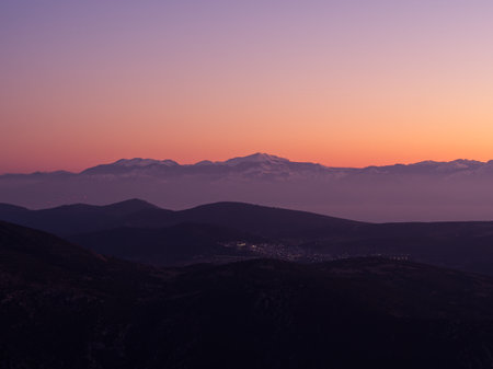 Mountain range covered in snow in dusk colors, Greeceの写真素材
