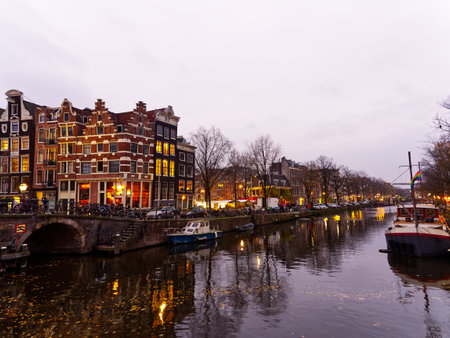 Amsterdam architecture and canals at moody evening in city lights, Netherlandsの写真素材