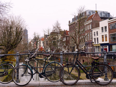 City bikes on a canal bridge, Utrecht, Netherlandsの写真素材