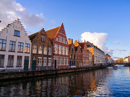 Idyllic canal reflections in medieval city of Bruges, Belgiumの写真素材