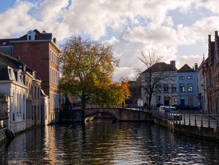 Idyllic canal reflections in medieval city of Bruges, Belgiumの写真素材