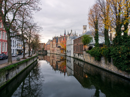 Idyllic canal view of medieval city of Bruges, Belgiumの写真素材