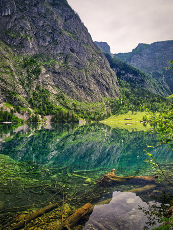 Lakeshore vertical view in the mountainsの写真素材