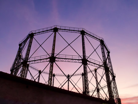 Gas tank in abandoned factory in sunset colours. Gazi, Athens, Greeceの写真素材