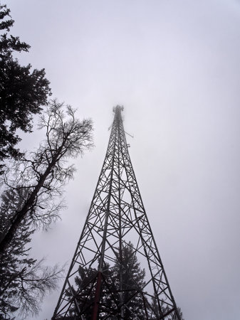 Low angle view of radio tower lost in fog. High quality photoの写真素材
