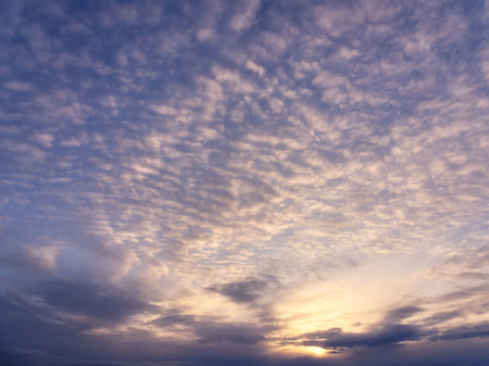 Dramatic sky with clouds at sunsetの写真素材