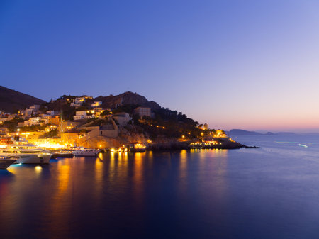 Majestic Sea and sailing boats view of Hydra island in blue hour colors, Saronic Gulf, Greeceの写真素材
