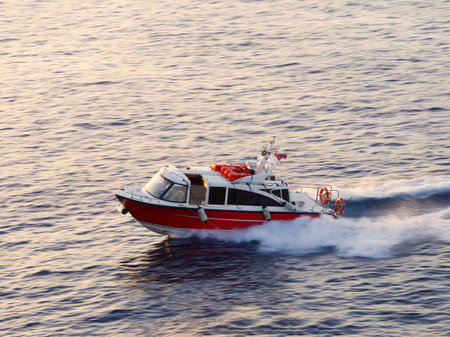 Taxi transport boat during sunset i at Hydra island. Saronic Gulf, Aegean Sea, Greeceの写真素材