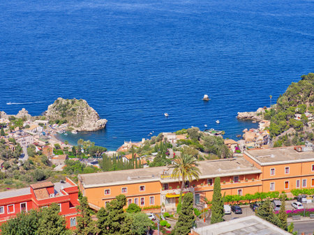 Coast of Sicily view as seen from Taormina theatre hill on a sunny summer day.の写真素材