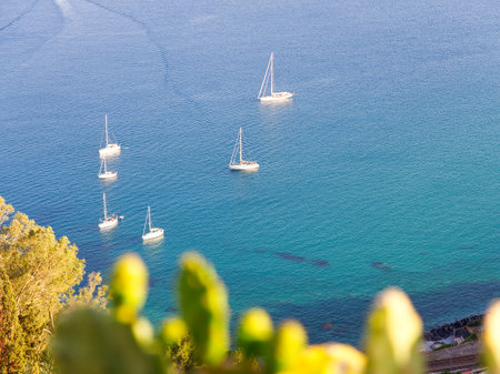 Sailing boats and yachts in Mediterranean coast high angle view, Taormina, Sicilyの写真素材