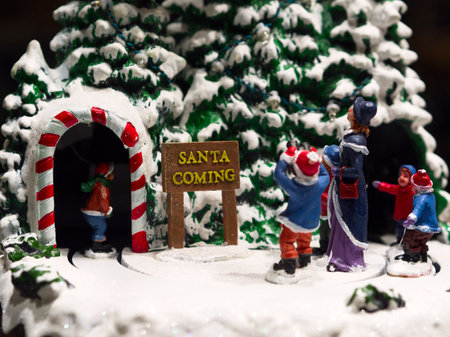 Miniature Christmas tree scene close-up with Santa Claus figurineの写真素材
